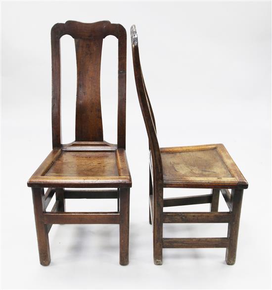 A set of six early 18th century oak dining chairs,